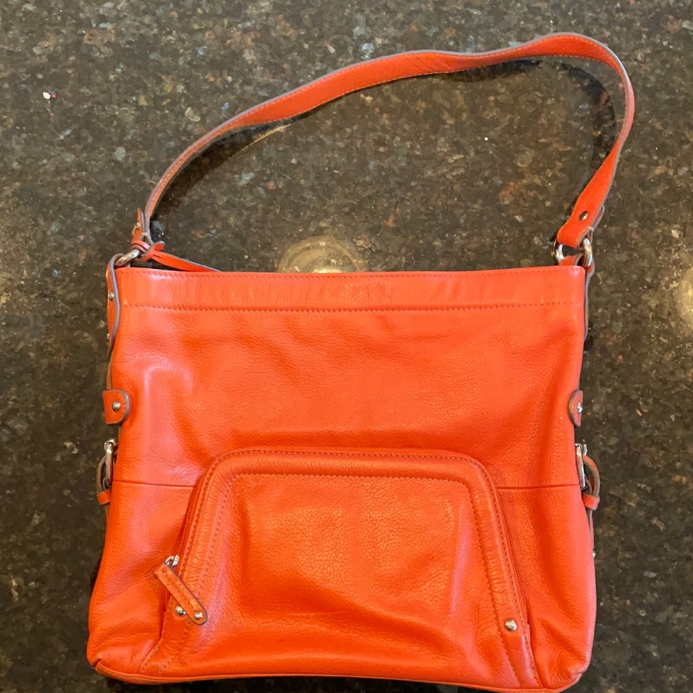 Tignanello orange leather purse in good condition.